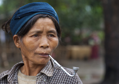 Khmu minority woman smoking pipe, Xieng khouang, Laos