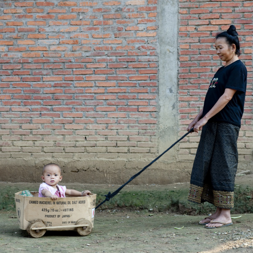 Mother and baby playing, Luang namtha, Laos