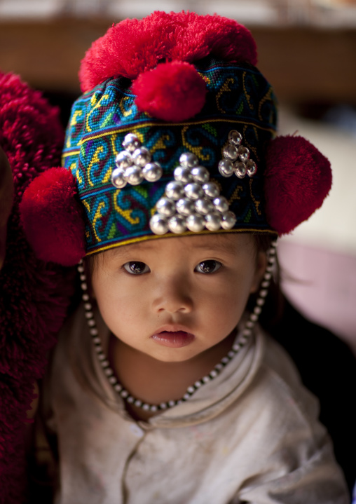 Yao minority kid with a traditional hat, Ban xay leck, Laos