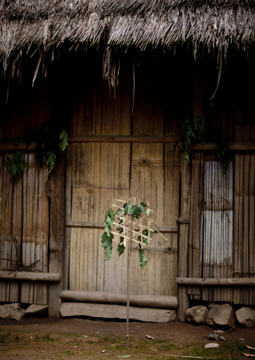 Hmong house with shaman warning sign, Muang sing, Laos