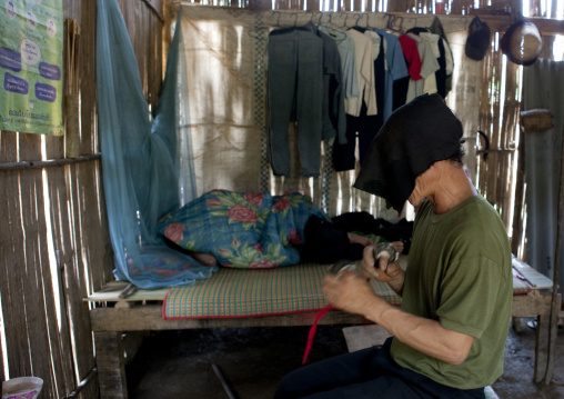 Hmong shaman during a ceremony, Muang sing, Laos