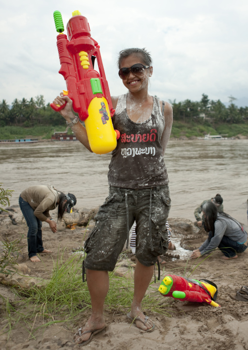 Girl with flour on the face during pii mai lao new year celebration, Luang prabang, Laos