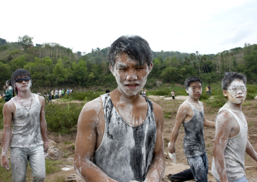 People with flour on the face during pii mai lao new year celebration, Luang prabang, Laos