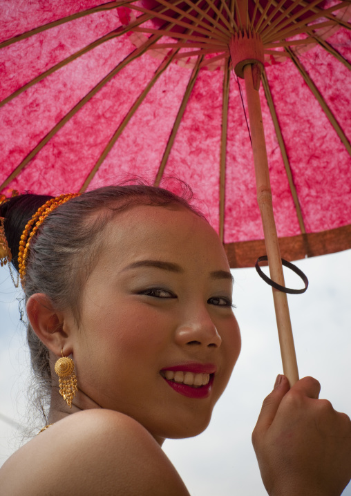 Girl in traditional clothing during pii mai lao new year celebration, Luang prabang, Laos