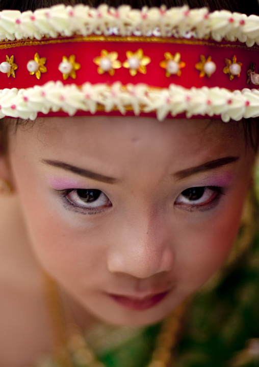 Girl in traditional clothing during pii mai lao new year celebration, Luang prabang, Laos