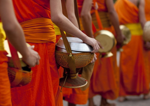 Lao buddhist monks collecting alms, Luang prabang, Laos