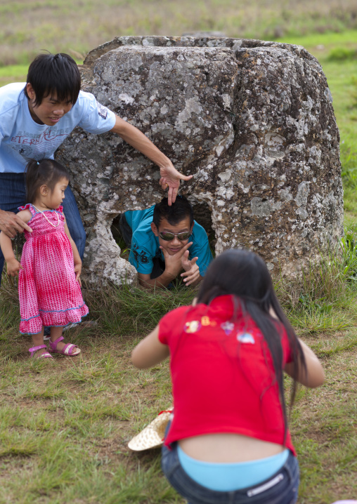 Tourists in the plain of jars, Phonsavan, Laos