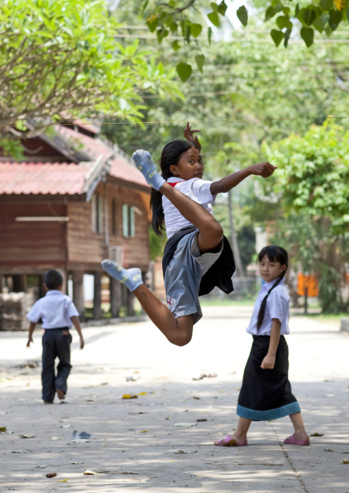 Lao girls palying in the street, Vientiane, Laos