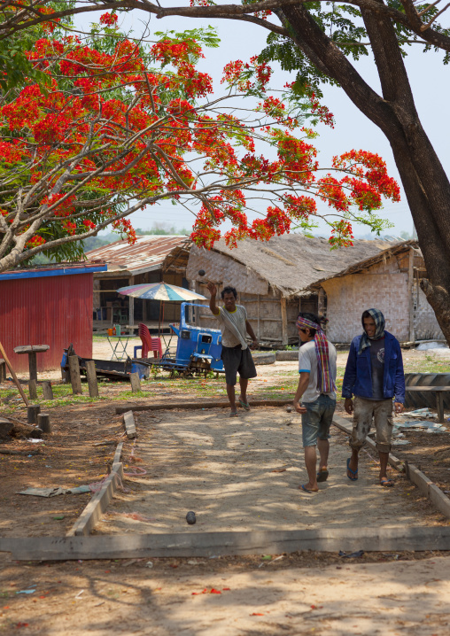 Men playing french petanque, Thakhek, Laos