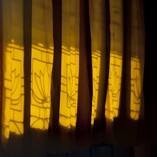 Curtains in front of a window, Savannakhet, Laos