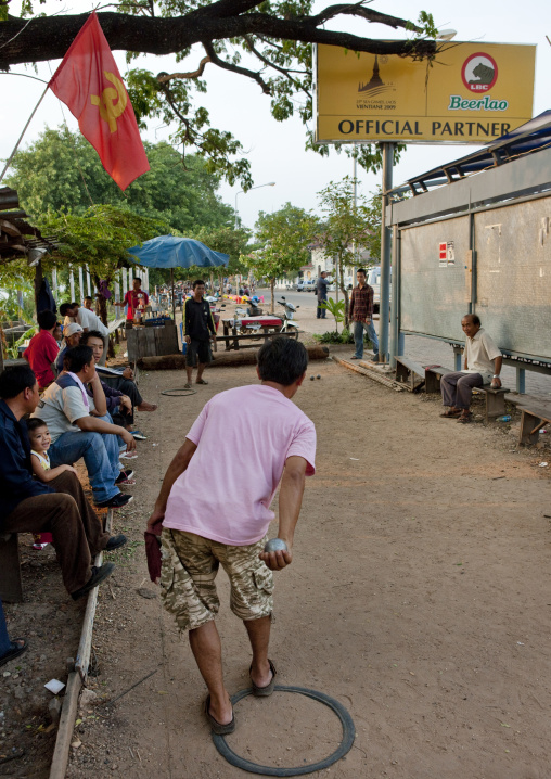 Men playing french petanque, Thakhek, Laos