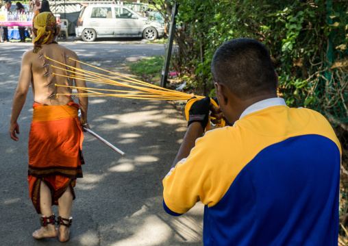 A Devotee Has His Back Pierced With Hooks During The Thaipusam Hindu Festival At Batu Caves, Southeast Asia, Kuala Lumpur, Malaysia