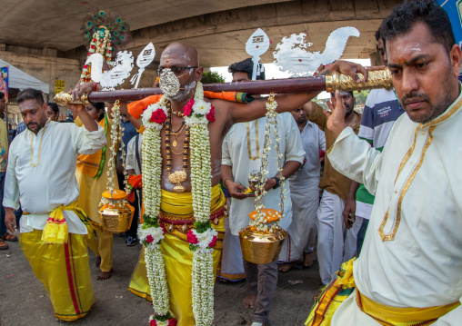 Hindu Devotee With A Metallic Mask In Annual Thaipusam Religious Festival In Batu Caves, Southeast Asia, Kuala Lumpur, Malaysia