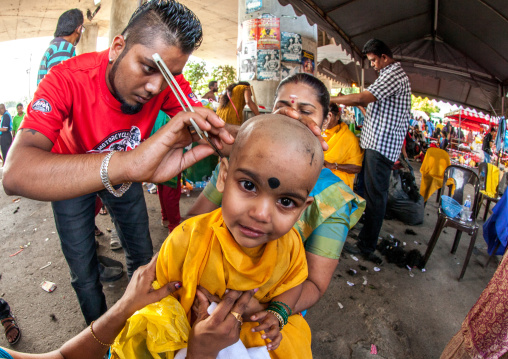 Child Being Shaved With A Razor In Annual Thaipusam Religious Festival In Batu Caves, Southeast Asia, Kuala Lumpur, Malaysia