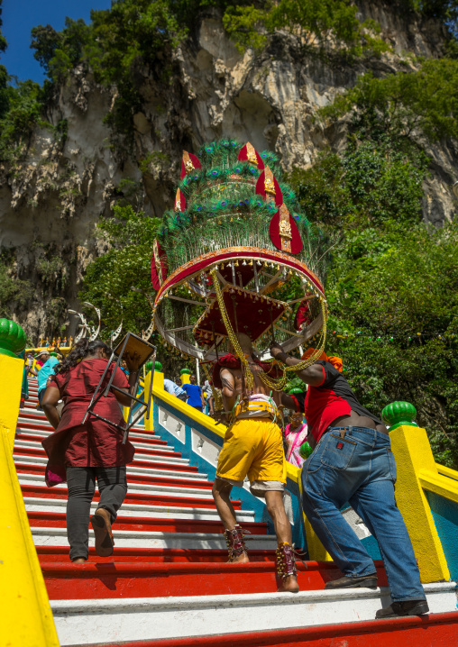 Devotee Kavadi Bearer Climbing Stairs At Thaipusam Hindu Religious Festival In Batu Caves, Southeast Asia, Kuala Lumpur, Malaysia