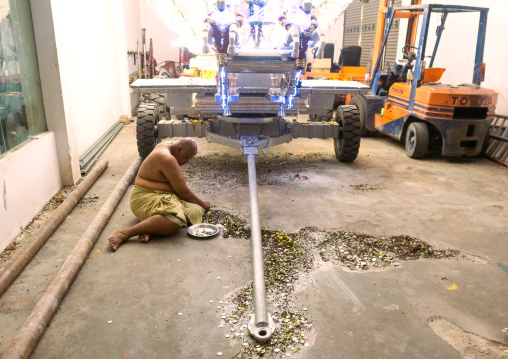 Hindu Priest In Annual Thaipusam Religious Festival Counting Coins Collected, Southeast Asia, Kuala Lumpur, Malaysia