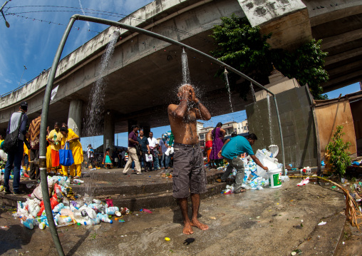 Hindu Pilgrim Taking Shower In Annual Thaipusam Religious Festival In Batu Caves, Southeast Asia, Kuala Lumpur, Malaysia