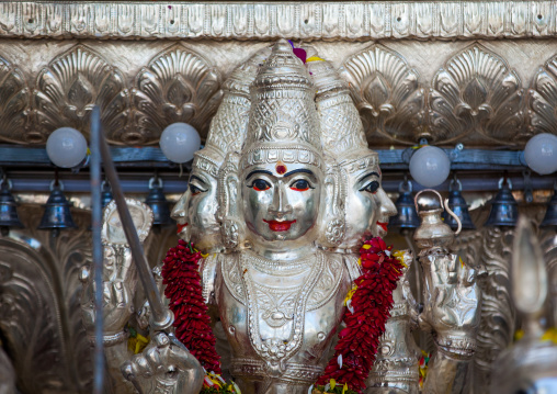 A Statue Of A Hindu Deity With Three Heads In Batu Caves, Southeast Asia, Kuala Lumpur, Malaysia