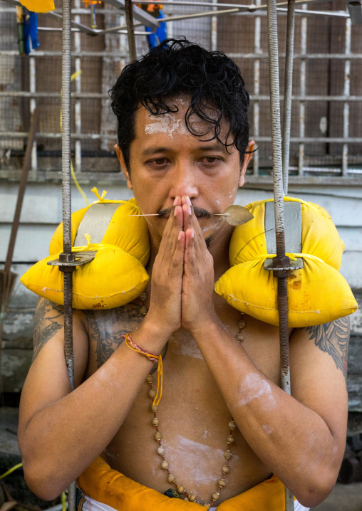 Hindu Devotee Praying In Annual Thaipusam Religious Festival In Batu Caves, Southeast Asia, Kuala Lumpur, Malaysia