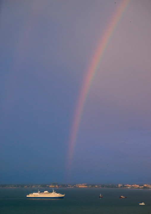 Cruise Boat In Front Of A Rainbow On The Sea, Penang Island, George Town, Malaysia