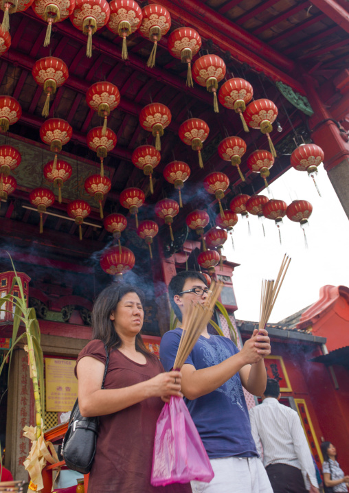 People Praying In A Temple Under Lanterns, George Town, Penang, Malaysia