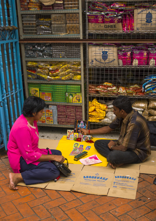 Man Telling The Fortune To A Woman In The Street, George Town, Penang, Malaysia