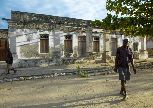 Men Passing In Front Of Some Old Portuguese Colonial Building, Ibo Island, Cabo Delgado Province, Mozambique