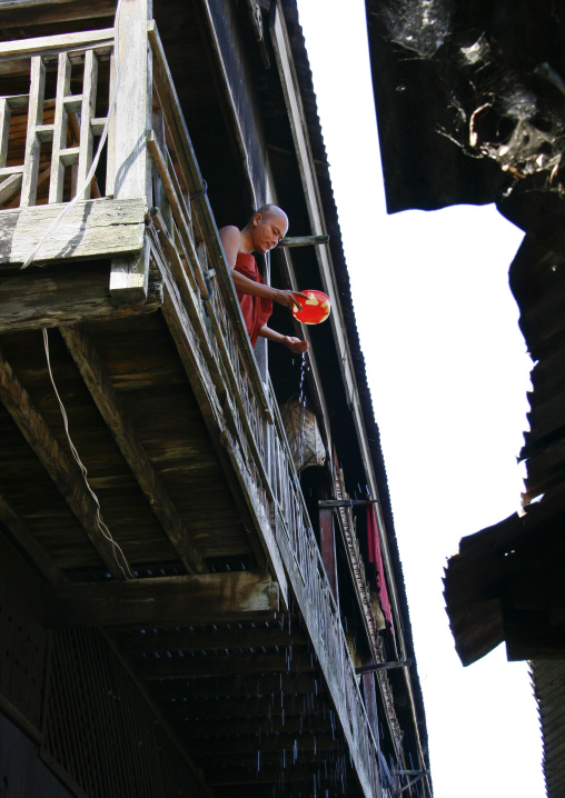 Monk On A Balcony In A Monastery In Rangoon, Myanmar