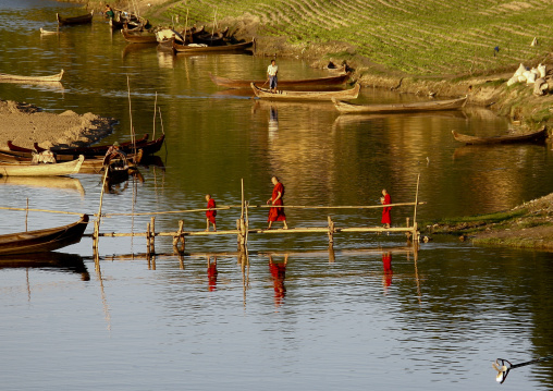 Buddhist Monks Crossing A Bridge, Bagan, Myanmar