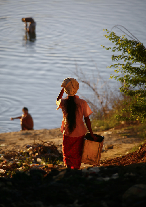 Women Collecting Water On Irrawaddy River Banks, Myanmar