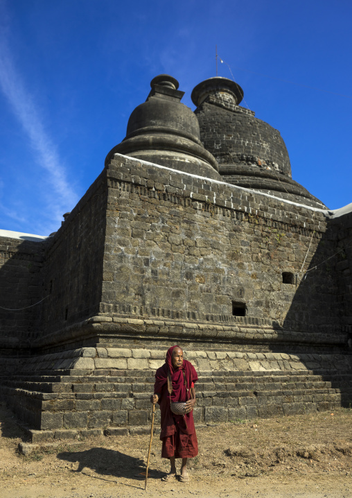 Old Monk Begging Food In Front Of A Buddhist Temple, Mrauk U, Myanmar