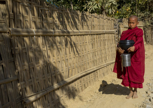 Novice Monk Begging For Food On A Road, Mrauk U, Myanmar