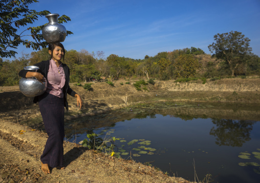 Woman Walking With Water Backet On Her Head Mrauk U, Myanmar