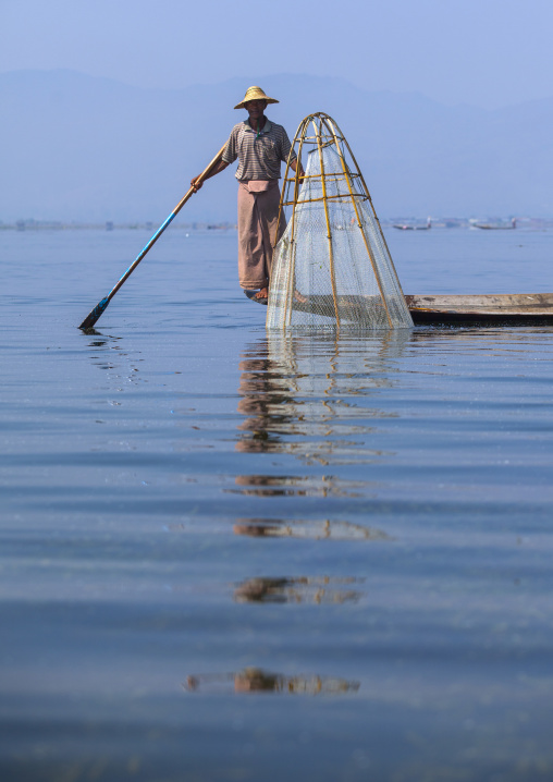 Traditional Fisherman With Fish Trap In Boat, Inle Lake, Myanmar