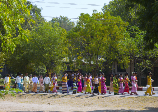 Women Walking To The Temple With Offerings For A Novitiation Ceremony, Bagan,  Myanmar