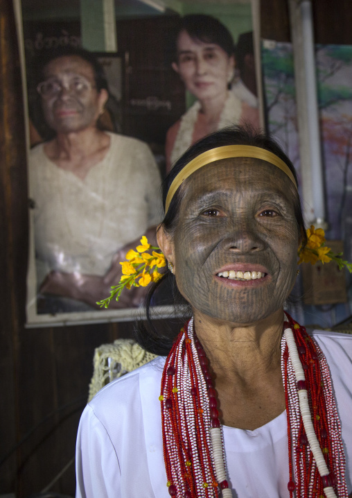 Miss Heu In Front Of A Picture She Took With Aung San
Suu Kyi, Kanpelet, Myanmar