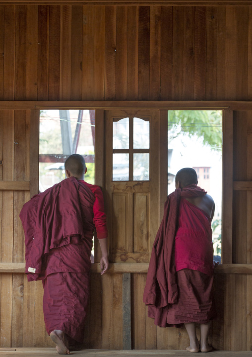 Novices Monks Looking Thru A Window, Inle Lake, Myanmar