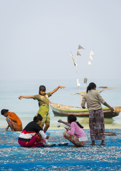 Women Putting Dried Fish On The Floor, Ngapali, Myanmar