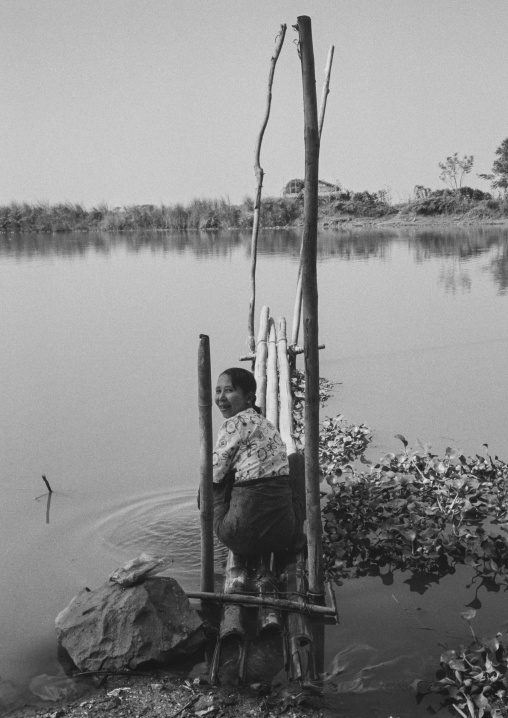 Woman Washing Clothes In The Water, Inle Lake, Myanmar