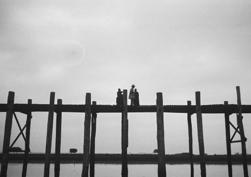 People Crossing U Bein Bridge In Amarapura, Mandalay, Myanmar