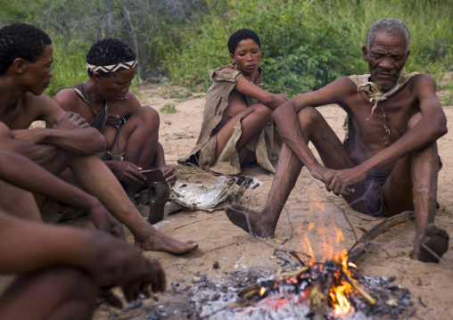 Bushman People Around A Fire In A Traditional Village, Tsumkwe, Namibia