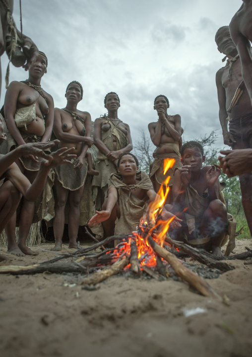 Bushman People Around A Fire In A Traditional Village, Tsumkwe, Namibia