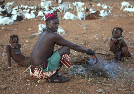 Himba Family In Front Of The Sacred Fire, Epupa, Namibia