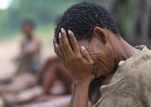 Bushman Woman Holding Her Head, Tsumkwe, Namibia