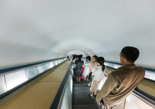 North Korean people using escalator leading to the subway station, Pyongan Province, Pyongyang, North Korea