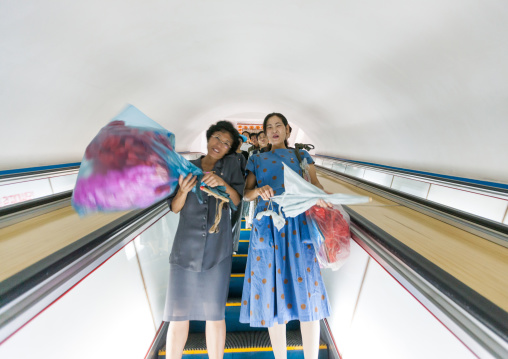 North Korean people using escalator leading to the subway station, Pyongan Province, Pyongyang, North Korea