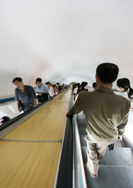 North Korean people using escalator leading to the subway station, Pyongan Province, Pyongyang, North Korea