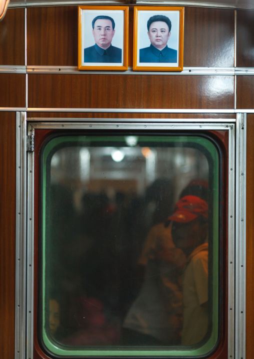 Official portraits of the Dear Leaders in a subway wagon, Pyongan Province, Pyongyang, North Korea