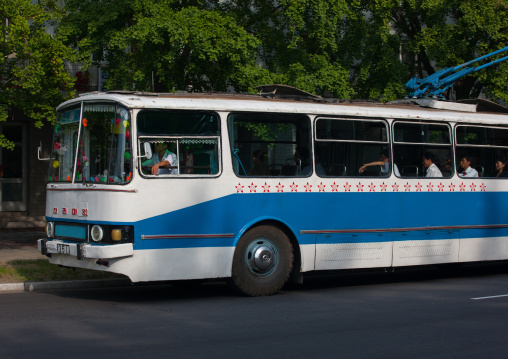 Public bus decorated with red stars one star represents 50000 km of safe driving, Pyongan Province, Pyongyang, North Korea