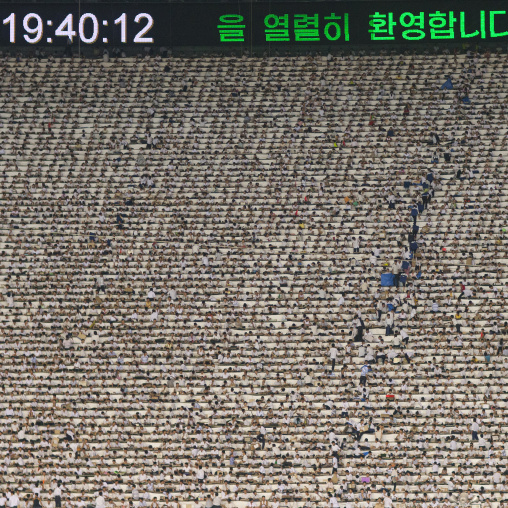 Children used to make human pixels by holding up colored boards during Arirang mass games in may day stadium, Pyongan Province, Pyongyang, North Korea